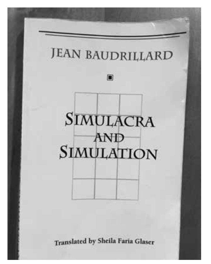 A photo of the book cover of Simulacra and Simulation by Jean Baudrillard. Photo by Hon. Abraham C. Meltzer. 